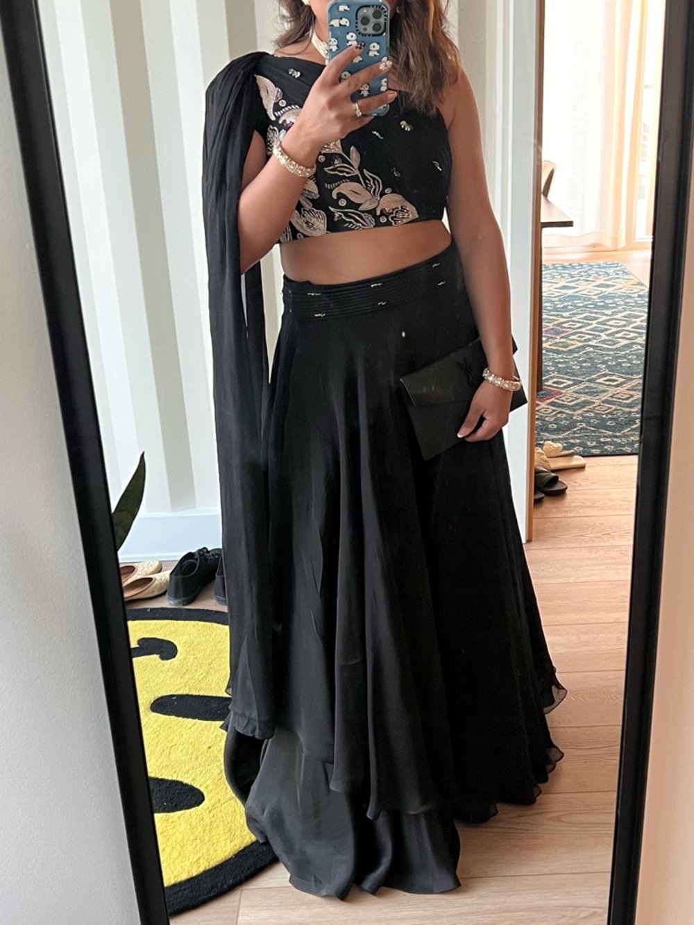 Isha Gupta Tayal Black Crepe Layered Lehenga Set with Embroidered Blouse